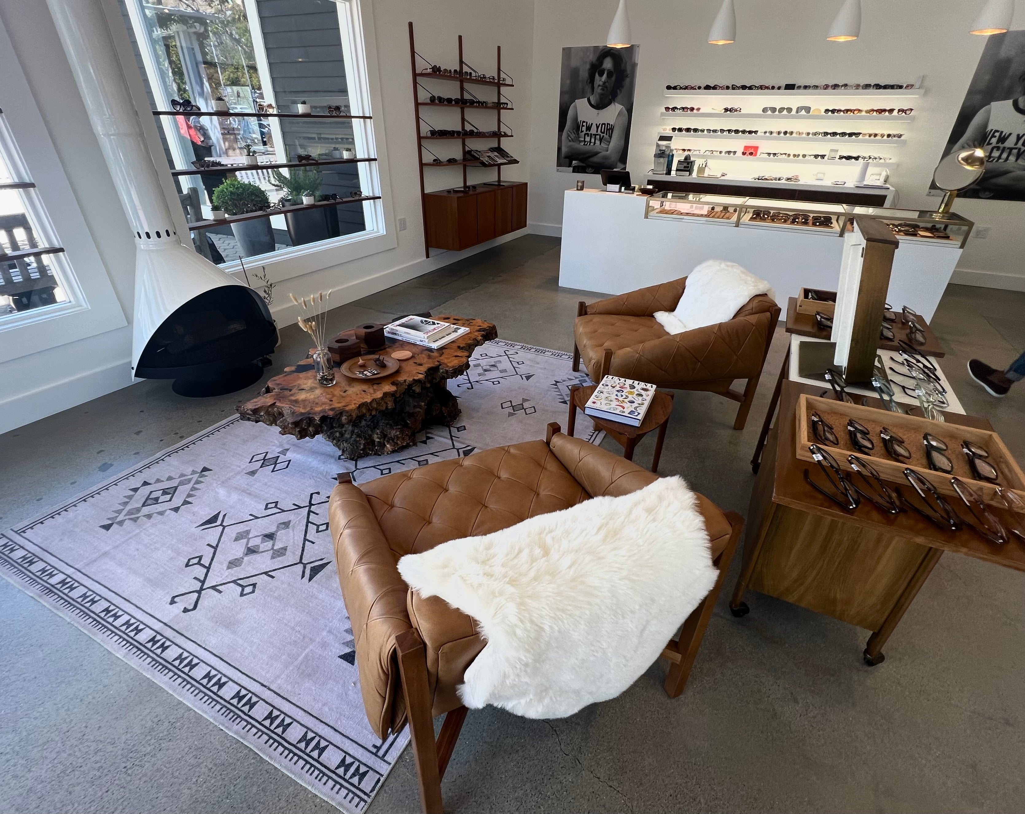 Modern interior design with brown leather chairs, a rug, and decorative items.